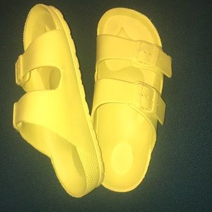 Yeallow slip on sandles.